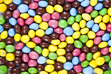 Image showing Pile of delicious rainbow colorful chocolate candies background.