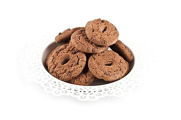 Image showing Fresh baked chocolate chip cookies heap on white plate isolated 