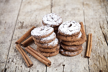 Image showing Fresh baked chocolate chip cookies with sugar powder and cinnamo