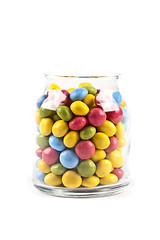 Image showing Colorful sweet candies in glass jar isolated on white.