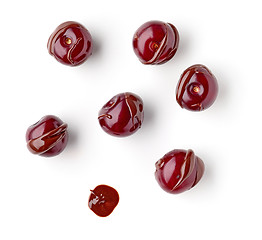 Image showing sour cherries covered with melted chocolate