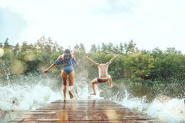 Image showing Enjoying river party with friends. Group of beautiful happy young people at the river together