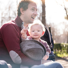 Image showing Father with cheerful child in the park.