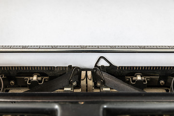 Image showing Vintage typewriter with blank sheet of paper retro technology