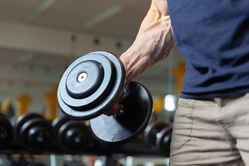 Image showing grabbing a dumbbell