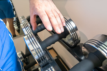 Image showing grabbing a dumbbell