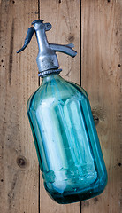 Image showing vintage turquoise soda glass bottle