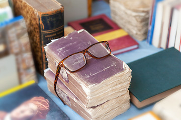 Image showing reading glasses on some old books