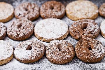 Image showing Chocolate chip and oat fresh cookies with sugar powder closeup