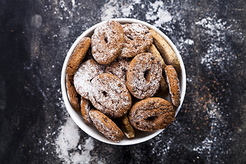 Image showing Fresh baked chocolate chip and oat fresh cookies with sugar powd