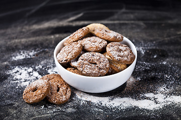 Image showing Fresh baked chocolate chip and oat fresh cookies with sugar powd