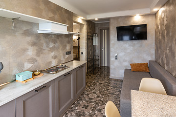 Image showing The interior of a small living room and kitchen in the hotel room.