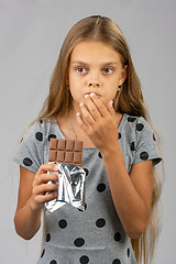 Image showing The teen girl got chocolate teeth