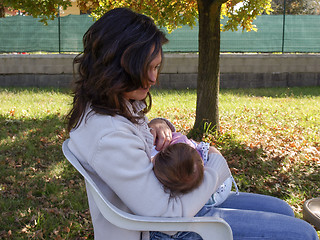 Image showing Woman breastfeeding baby