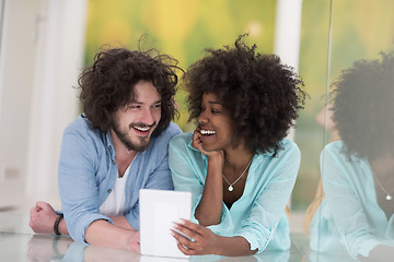 Image showing Couple relaxing together at home with tablet computer