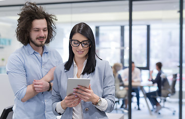 Image showing Business People Working With Tablet in startup office