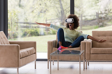 Image showing black woman using VR headset glasses of virtual reality