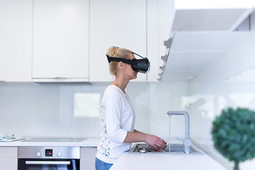 Image showing woman using VR-headset glasses of virtual reality