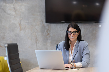 Image showing businesswoman using a laptop in startup office