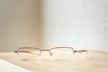 Image showing reading glasses on a wooden table