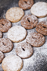 Image showing Chocolate chip and oat fresh cookies with sugar powder closeup.