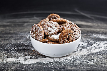 Image showing Fresh baked chocolate chip and oat fresh cookies with sugar powd