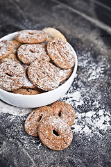 Image showing Fresh baked chocolate chip and oat fresh cookies with sugar powd