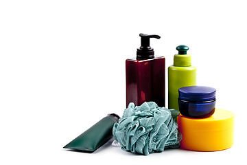 Image showing Bath cosmetic products and sponge on white background. 