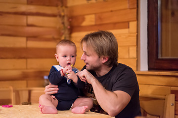 Image showing Portrait of young father and his cute baby son