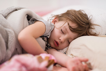 Image showing little gir sleeping in bed at home