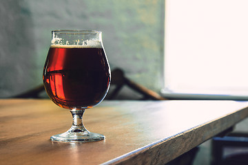 Image showing Glasses of different kinds of beer on wooden background