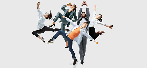 Image showing Office workers or ballet dancers jumping on white background