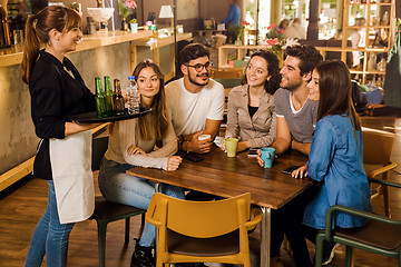 Image showing Talking to the waitress