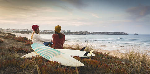 Image showing Surfer girls at the beach