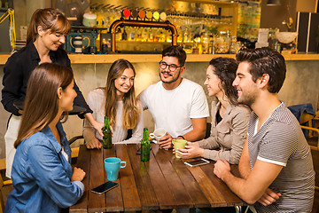 Image showing Talking to the waitress