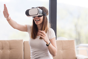 Image showing woman using VR-headset glasses of virtual reality