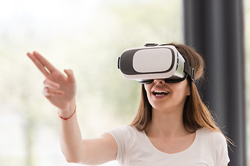 Image showing woman using VR-headset glasses of virtual reality