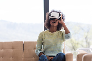 Image showing black woman using VR headset glasses of virtual reality