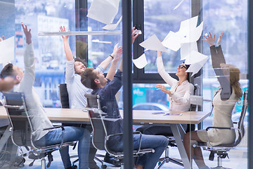 Image showing startup Group of young business people throwing documents