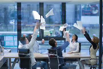 Image showing startup Group of young business people throwing documents