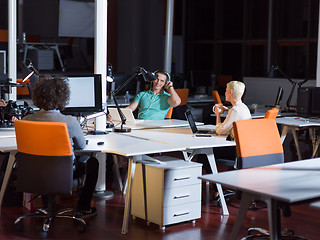 Image showing designers in the night startup office