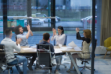 Image showing startup Group of young business people celebrating success