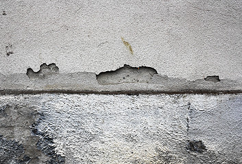 Image showing cracked plaster surface on damp wall