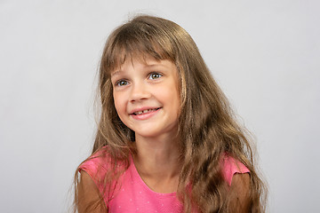 Image showing Portrait of a beautiful eight-year-old gay girl of Europe who looks to the left