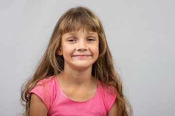 Image showing Portrait of a beautiful eight year old cheerful Europeans girl
