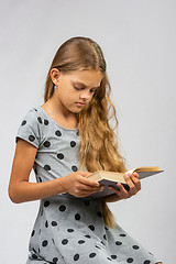 Image showing Teen girl reads a book