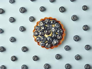 Image showing blueberry tart on light blue background