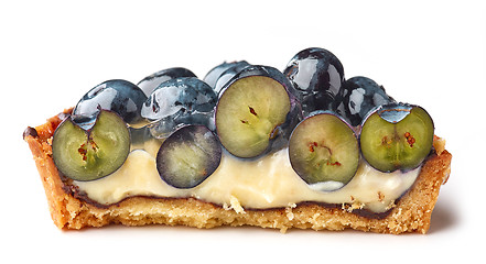 Image showing half of blueberry tart on white background