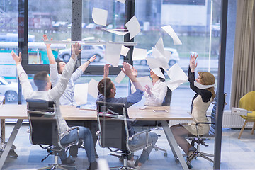 Image showing startup Group of young business people throwing documents