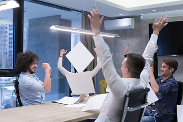 Image showing startup Group of young business people throwing documents